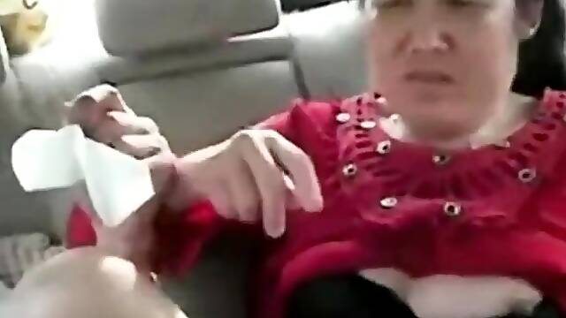 Asian older couple in the car