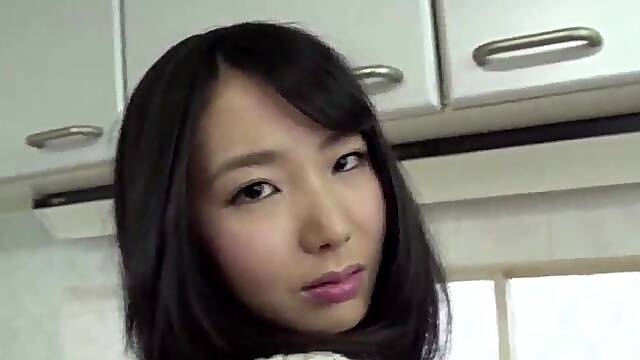 Japanese babe is getting fingered in the kitchen first