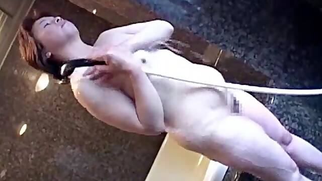 Asian mature dildoed in the bathroom