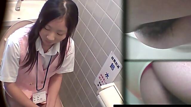Lens grabs stunning Japanese workers peeing in toilet bowl