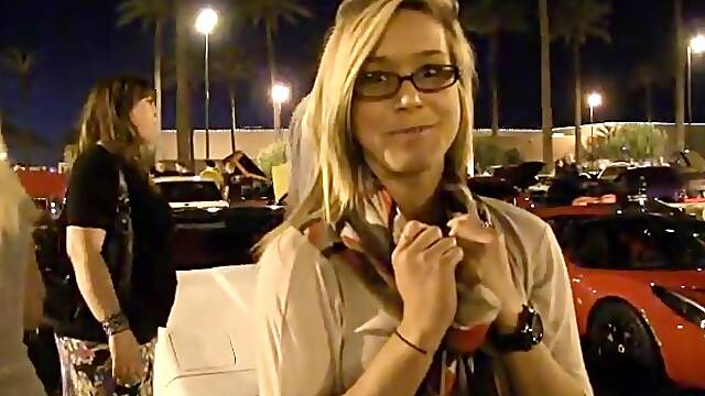 Slutty blonde Kennedy demonstrates her natural tits in the street