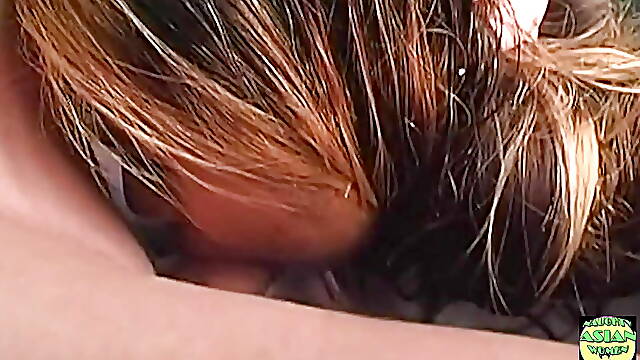 In a Phenomenal Threesome an Asian Brunette Enjoys Rough Sex While Being Double Penetrated